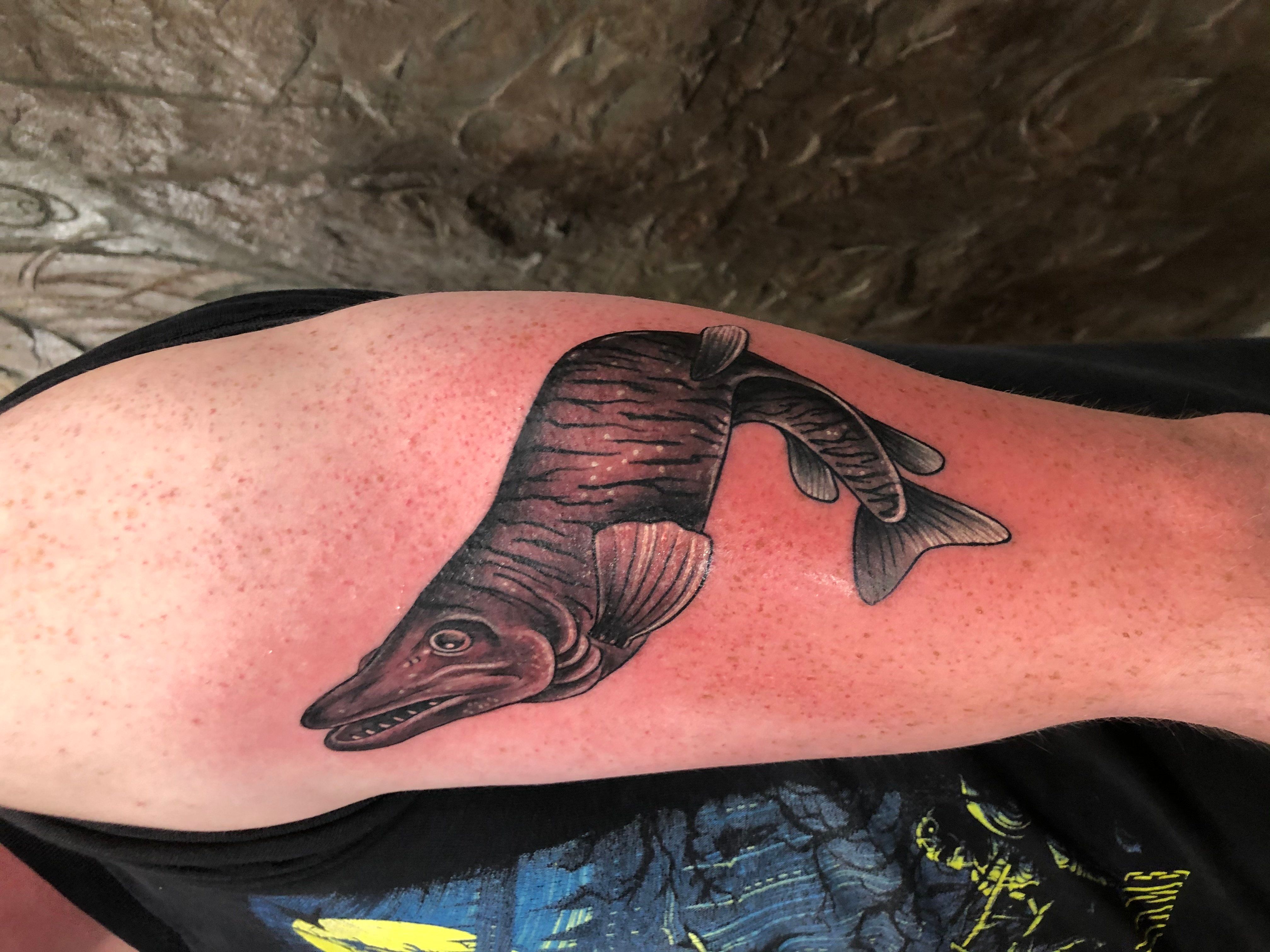 Fish With Sharp Teeth Arm Tattoo