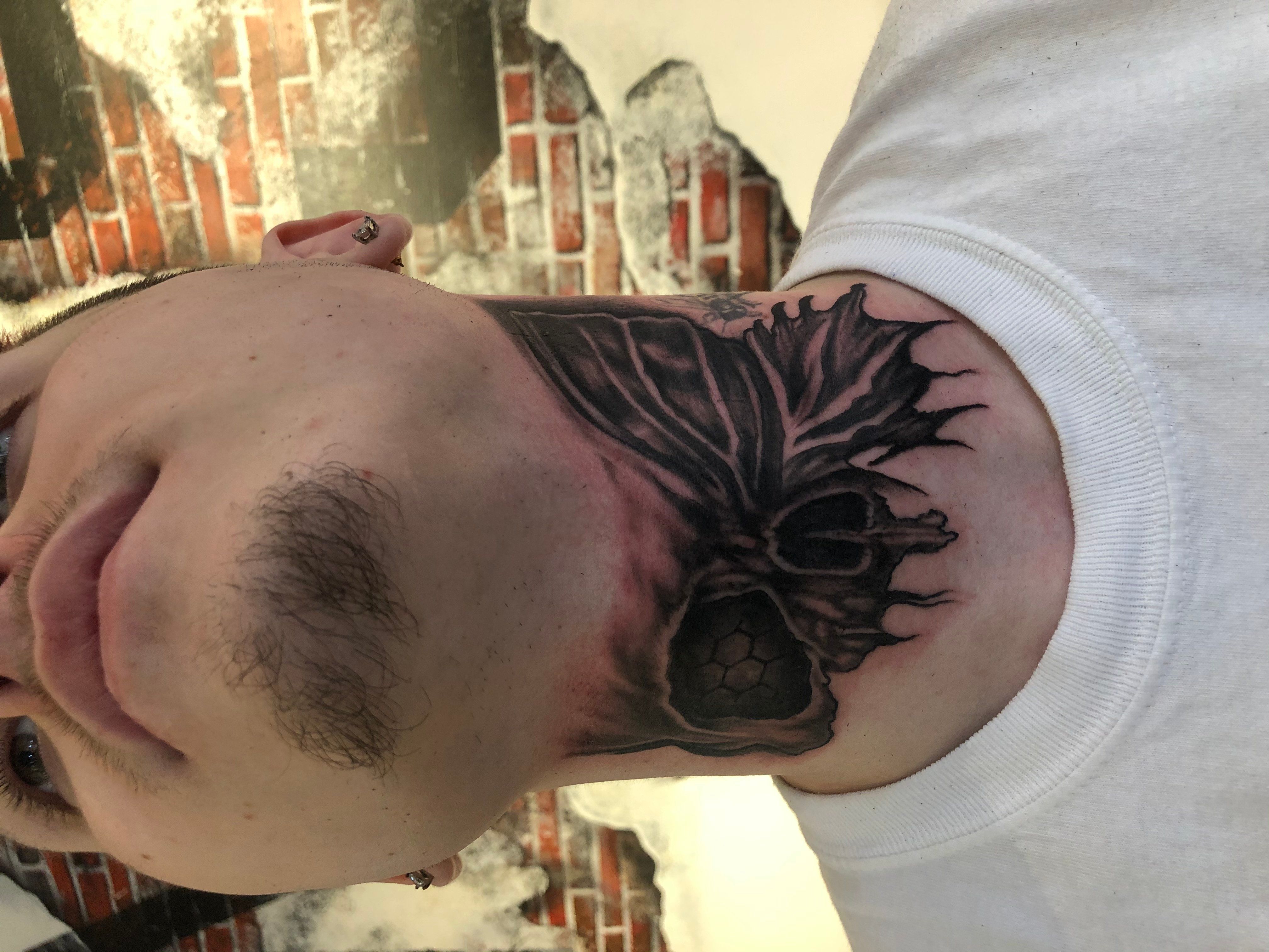 Partial Skull Neck Tattoo